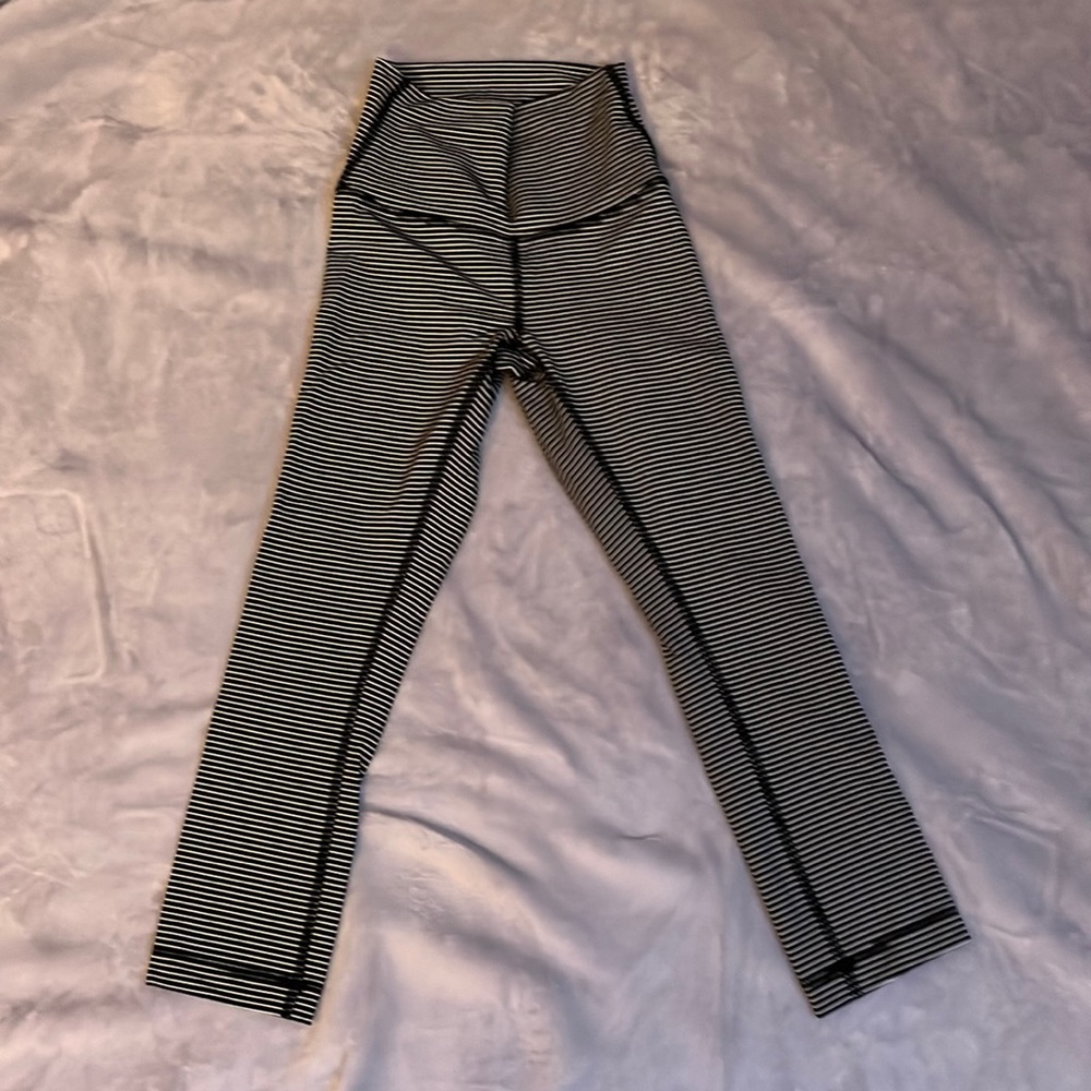 Size to length 23 inch Lululemon leggings, striped, black, and white